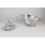Two silver plated toast racks one with four divisions on oval base together with a silver plated