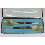 A case set of horn salad servers with silver plated monogrammed mounts by MacGregor Jeweler, Perth