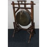 A Victorian dinner gong on bamboo stand, 55cm wide (NC)