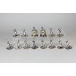 A set of twelve Royal Naval menu holders in the form of torpedoes, inscribed HMS Fulmar, and a