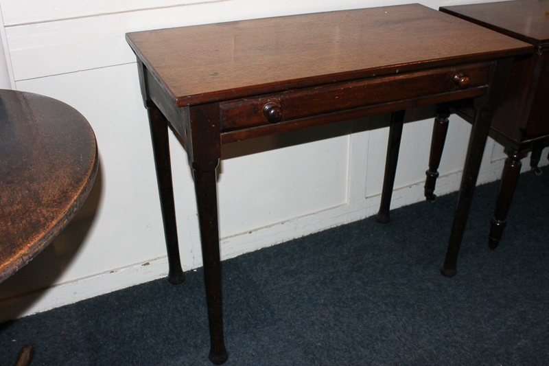 A 19th century mahogany rectangular side table, with single drawer, on tapered legs and shaped feet,