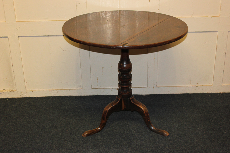 A George III tripod table with circular tilt-top on baluster stem, 75cm