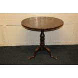 A George III tripod table with circular tilt-top on baluster stem, 75cm