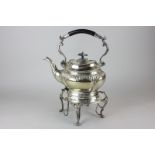 A Mappin & Webb silver plated kettle on stand with burner, on cabriole claw feet