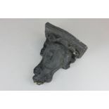 A painted plaster wall bracket of a classical head, 20cm high (NC)