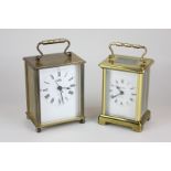 A brass and  bevelled glass cased carriage clock, the face stamped Baynard, 8 day, made in France (