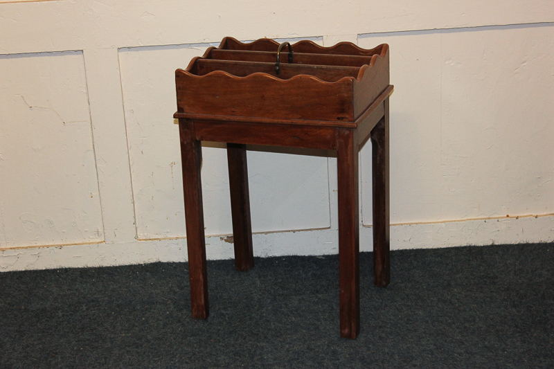 A three division stationery box with carry handle, on square chamfered legs, 37cm