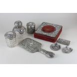 Eight Victorian and later silver and silver mounted dressing table items including a hand mirror,