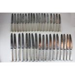 Eighteen 19th century steel blade table knives and eighteen dessert knives stamped Goldsmiths and