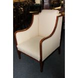 An Edwardian armchair, in cream lattice design upholstery, with crossbanded surround, on square