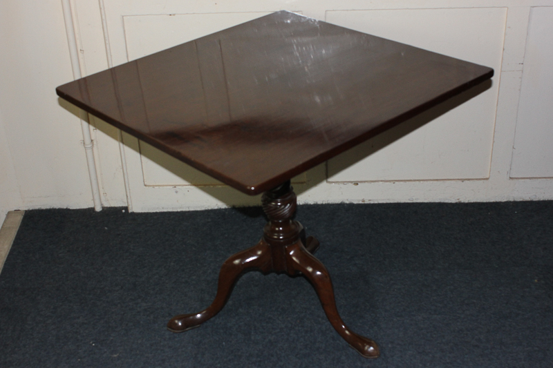 A mahogany tilt-top table, with rectangular top, on spiral turned tripod base, 77cm by 74cm