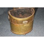 A brass oval coal scuttle/log bin with two handles and pierced border, 41cm (NC)