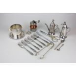 A silver plated dressing table set, a pair of Vermouth dispensers, a pepper mill, a strainer and