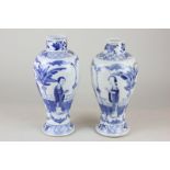 A pair of Chinese blue and white baluster vases depicting ladies reading, character marks to base