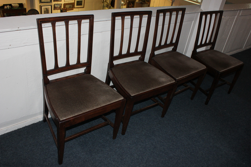 A set of four 19th century dining chairs, with tapered rail backs, drop in seats, on square