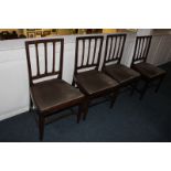 A set of four 19th century dining chairs, with tapered rail backs, drop in seats, on square