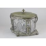 A silver plate mounted biscuit box with etched glass liner, decorated with harvest figures and