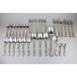 A George IV and later silver part matched Kings pattern canteen comprising a serving spoon, ladle,