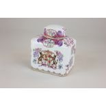 A Chinese porcelain tea caddy with a hand painted armorial crest showing two panthers rearing up