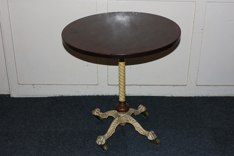 A Victorian circular mahogany occasional table, on painted cast iron stem and four legs with paw