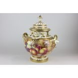 A large Royal Worcester porcelain pot pourri and cover, decorated with fruit, signed Freeman, with