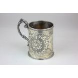 A Victorian silver christening mug with chased floral cartouches, presented, maker William Hunter,