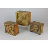 A miniature model of Chinese cabinet, and two chests of drawers, each with elaborate inlaid