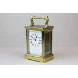 A brass and bevelled glass cased carriage clock, the white enamel face marked Collingwood & Son,