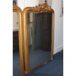 A pair of giltwood and gesso rectangular wall mirrors, with cartouche and scroll surmounts, and