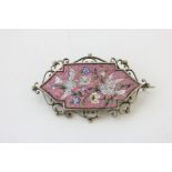 A silver mounted micro-mosaic brooch the shaped rectangular panel depicting doves delivering a '