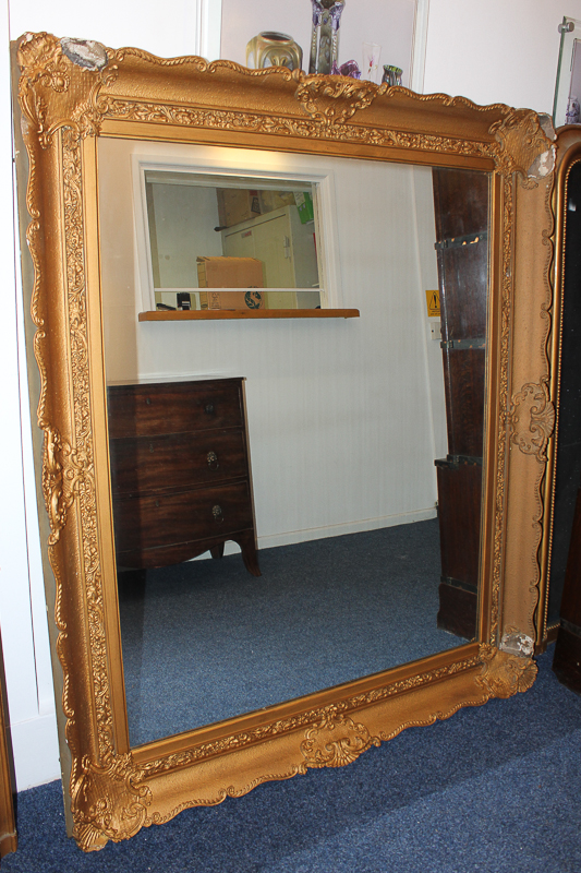 A giltwood and gesso large rectangular wall mirror, with scroll decorated border (a/f), overall size