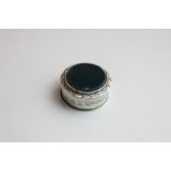 A silver patch box with leaf  engraved bands and later applied black onyx panel, Birmingham c1800 by