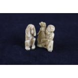 A Japanese carved ivory netsuke of a seated man with bushel, 4cm and another figure of a monkey