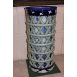 A Chinese porcelain reticulated stick stand the inner cylinder with blue and white decoration of