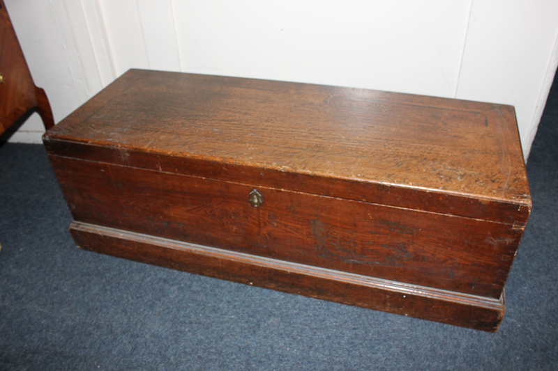 A 19th century oak trunk, with carry handles, a plinth base, 103cm