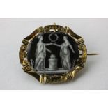 A gold and enamel mourning brooch the oval panel enamelled on copper with a classical scene, hair