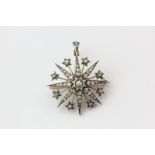 A late Victorian starburst brooch with pendant fitting set throughout with graduated old cut