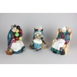 Three Royal Doulton porcelain figures including a pre 1959 The Old Balloon Seller (HN1315), Forty