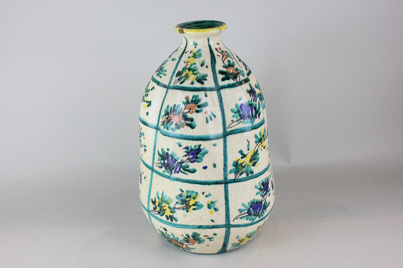 A Spanish pottery gourd shaped vase with floral motifs in bright colours, 29cm