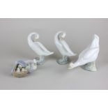 Two Lladro porcelain swans, a Lladro duck group and a Nao goose with box