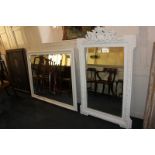 An ornately framed wall mirror painted white over gilt finish with shell and scroll finial (a/f)