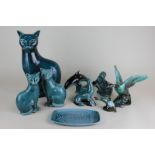 A collection of Poole Pottery blue glazed figures including a seated cat, 30cm, cats, seals and