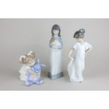 Three Nao porcelain figures, How Much I Love You, Picking Your Puppy and Nightgown with Flight,