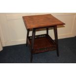 An Edwardian mahogany square occasional table with shell inlay and under tier with carved gallery,