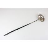 An unmarked silver toddy ladle with George II coin inset, on barley twist whalebone handle (a/f -