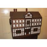 A large Tudor style doll's house made by Rev John Sparshatt, and taken around the world to collect
