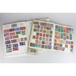 Two stamp albums containing turn of the century and later stamps from Britain and around the