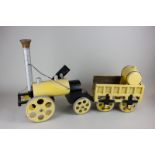 A wooden model toy of a steam train with truck, 67cm long