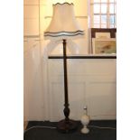 A carved mahogany standard lamp together a carved white stone table lamp (af) and three matching