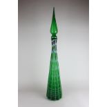 A large green glass Montrose decorative bottle with stopper, with white waved design, Montrose